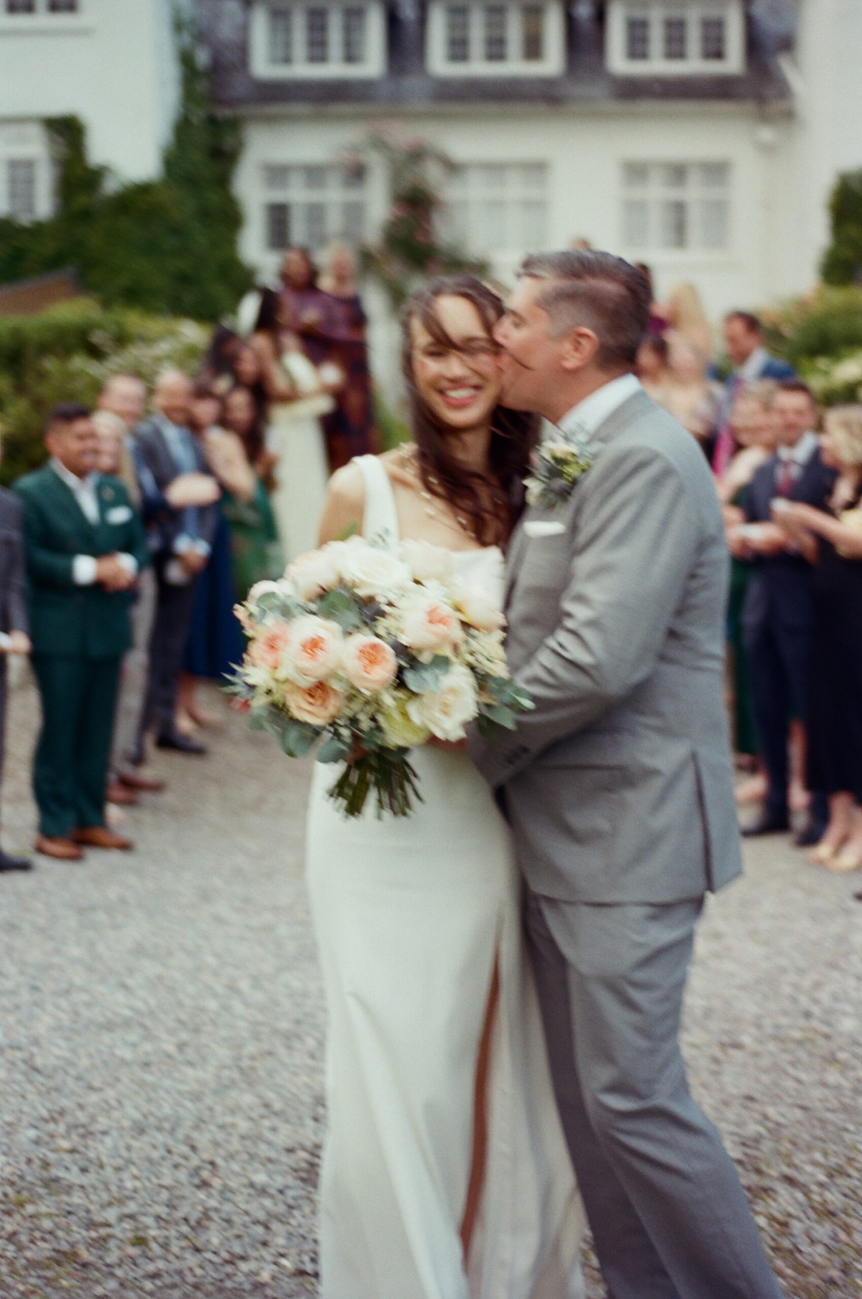 groom kisses bride 