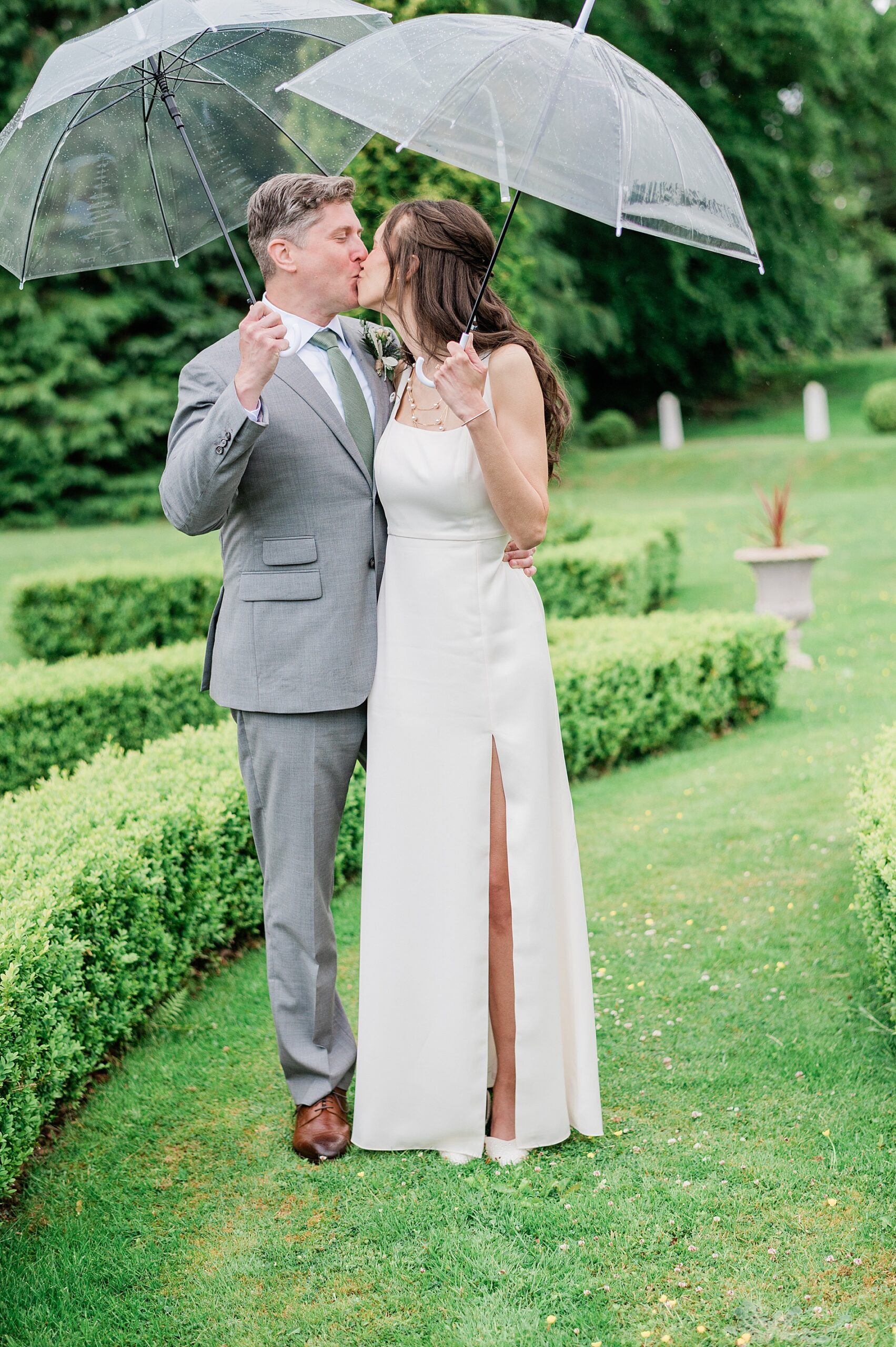 bride and groom portraits in the rain 