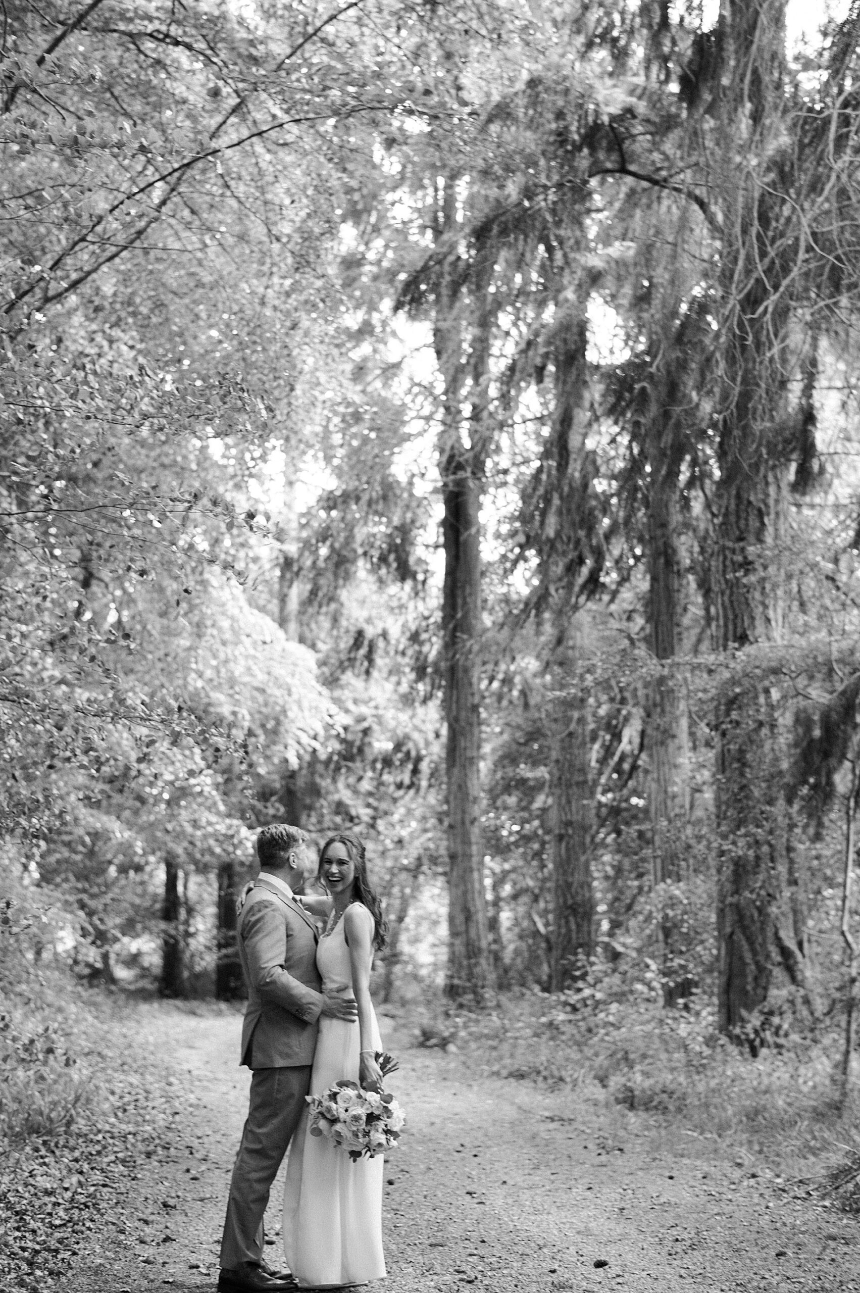 bride and groom walk path around castle 