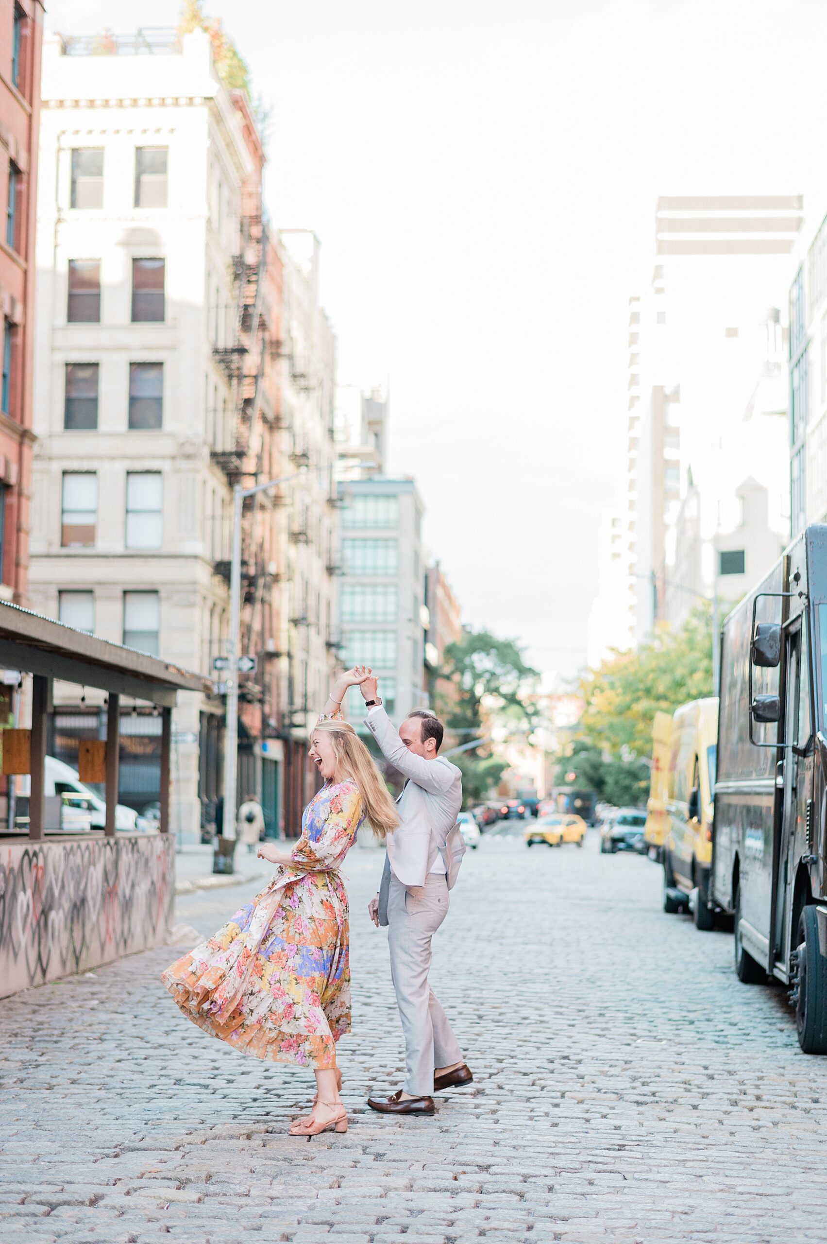 couple dance in street during Summer Engagement in Tribeca NYC