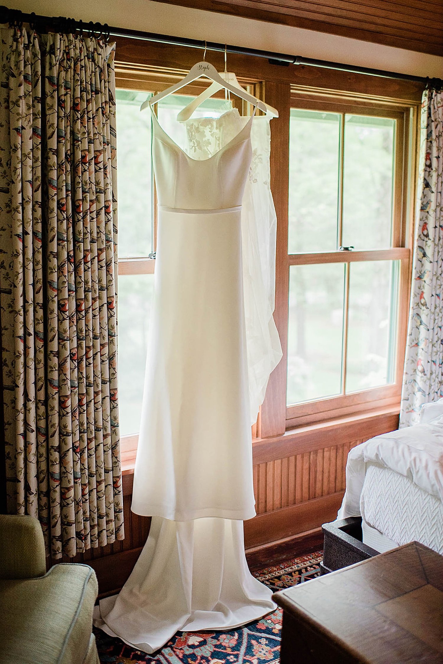 wedding dress hanging from window