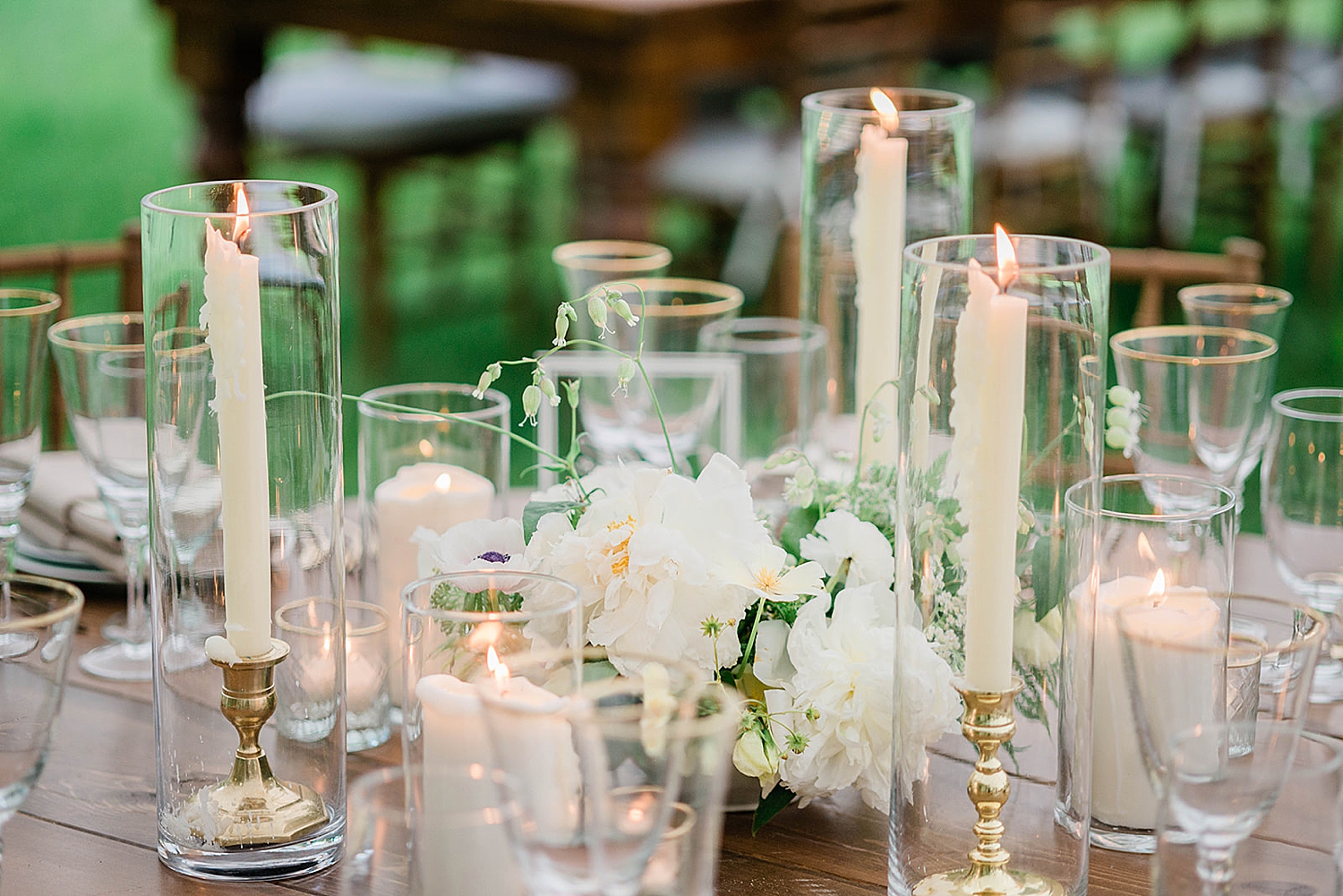 candlelight and white details decorate tables at reception