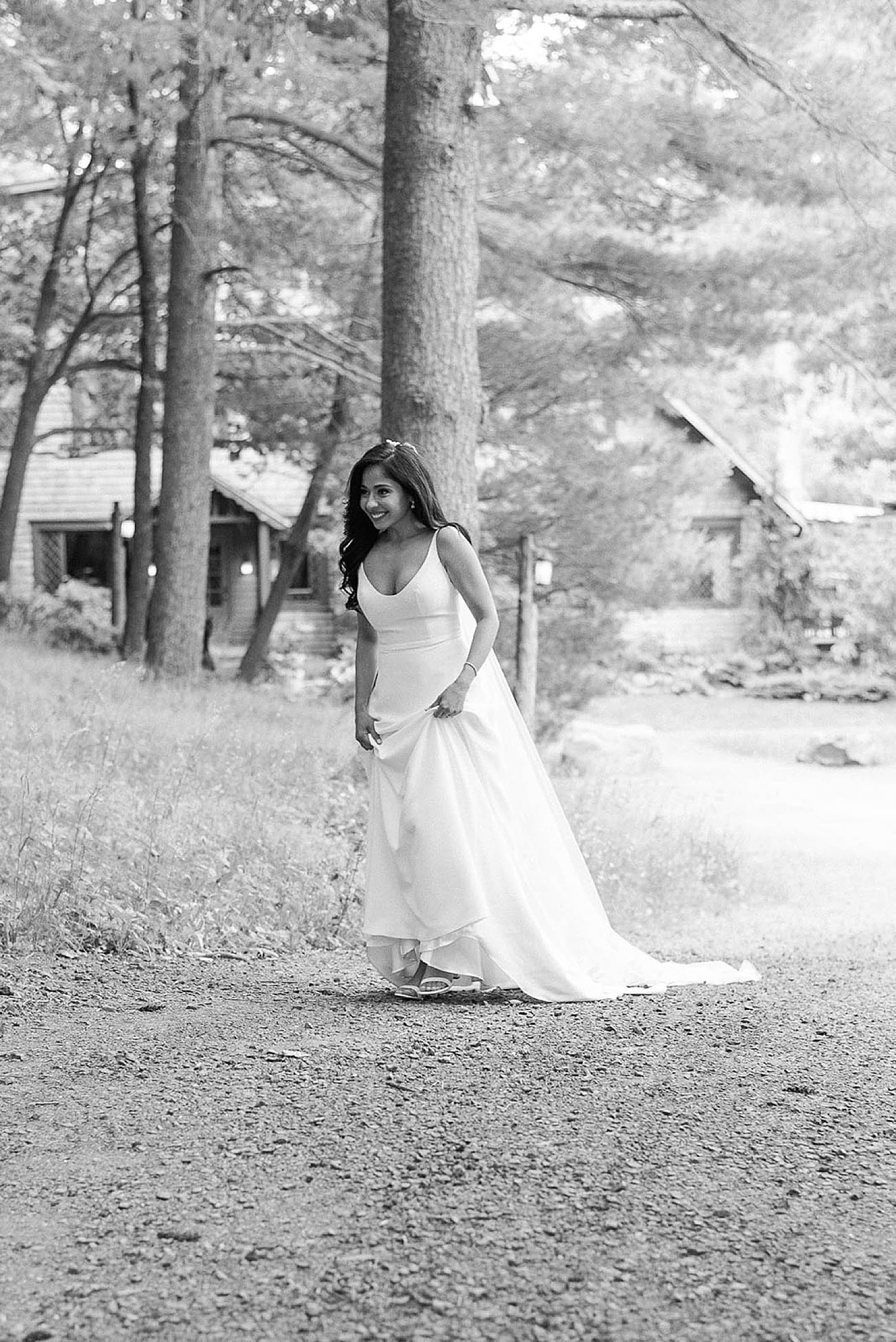 bride walking up path to meet groom for first look