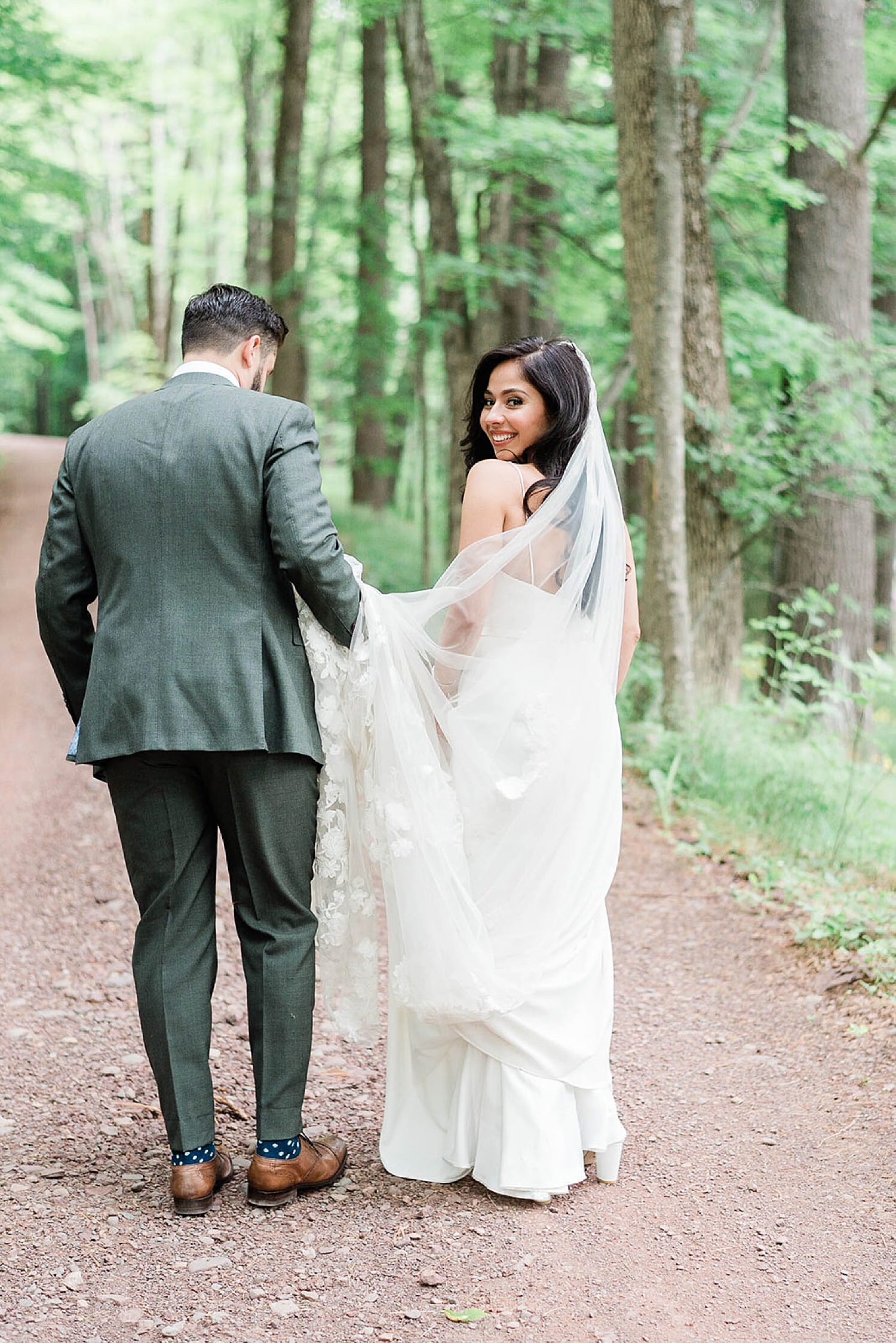 bride and groom portraits in the woods at Deer Mountain Inn