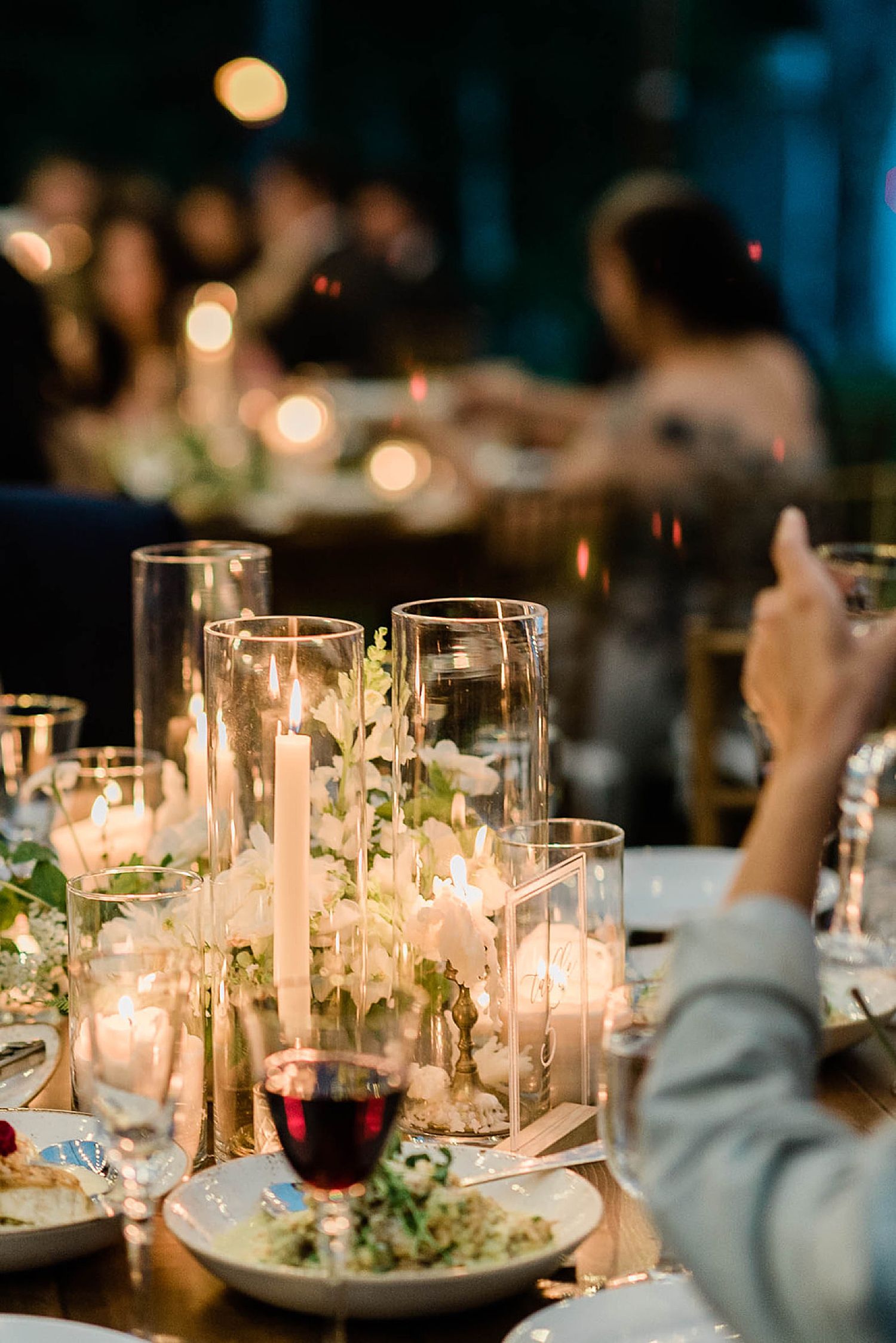wedding reception at night lit up with candles