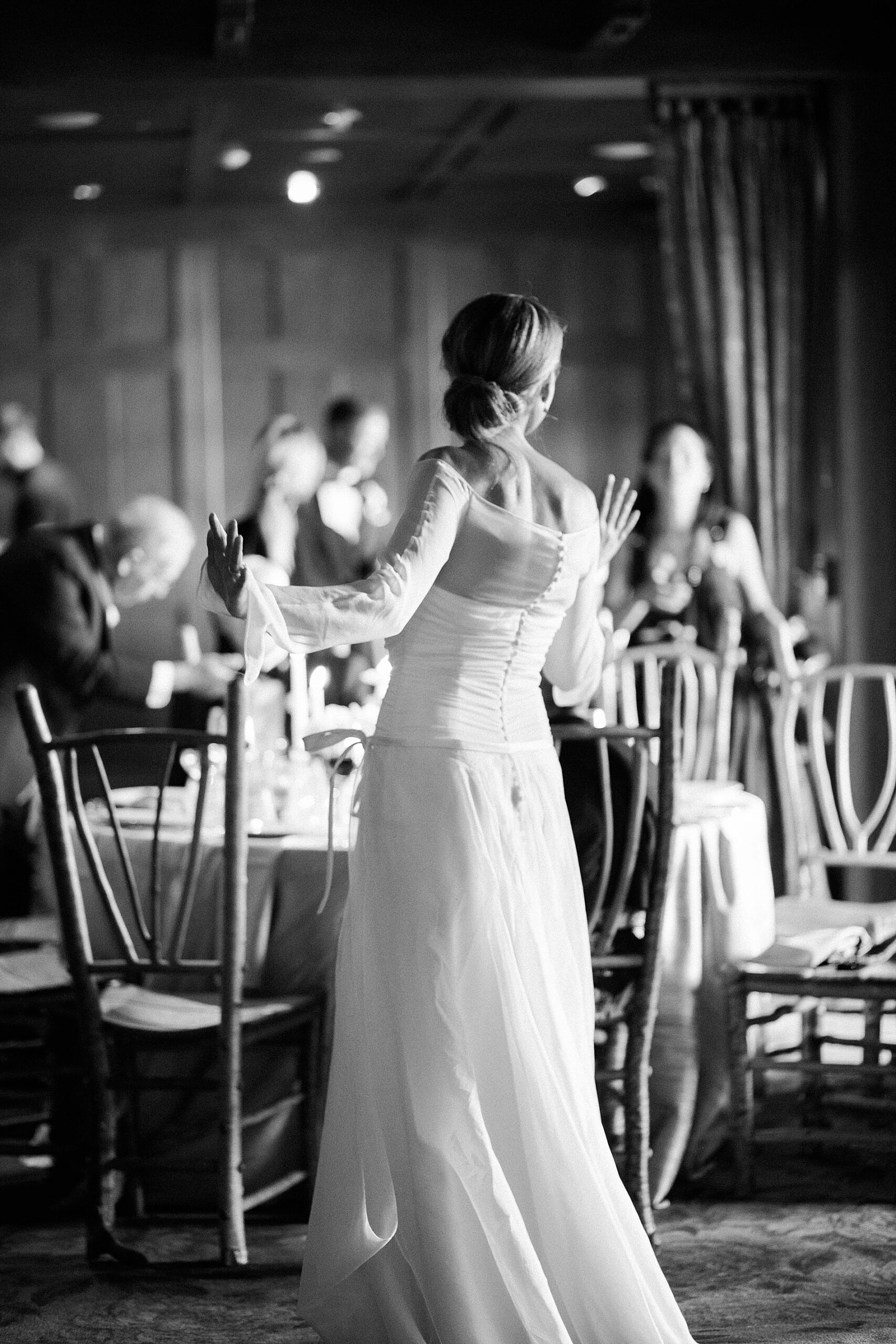 candid bride portraits inside wedding reception