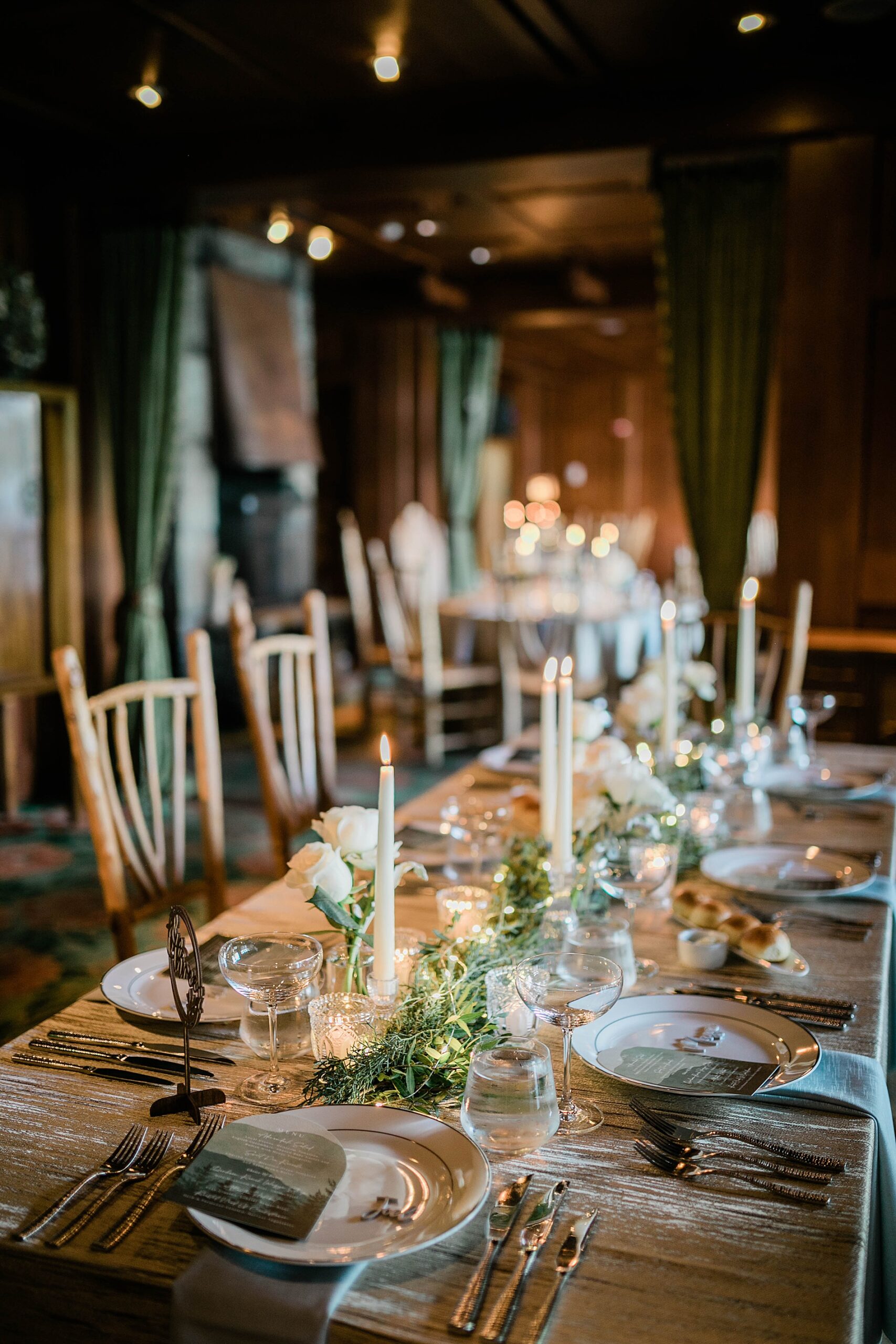 elegant tablescape with candlelight and greenery