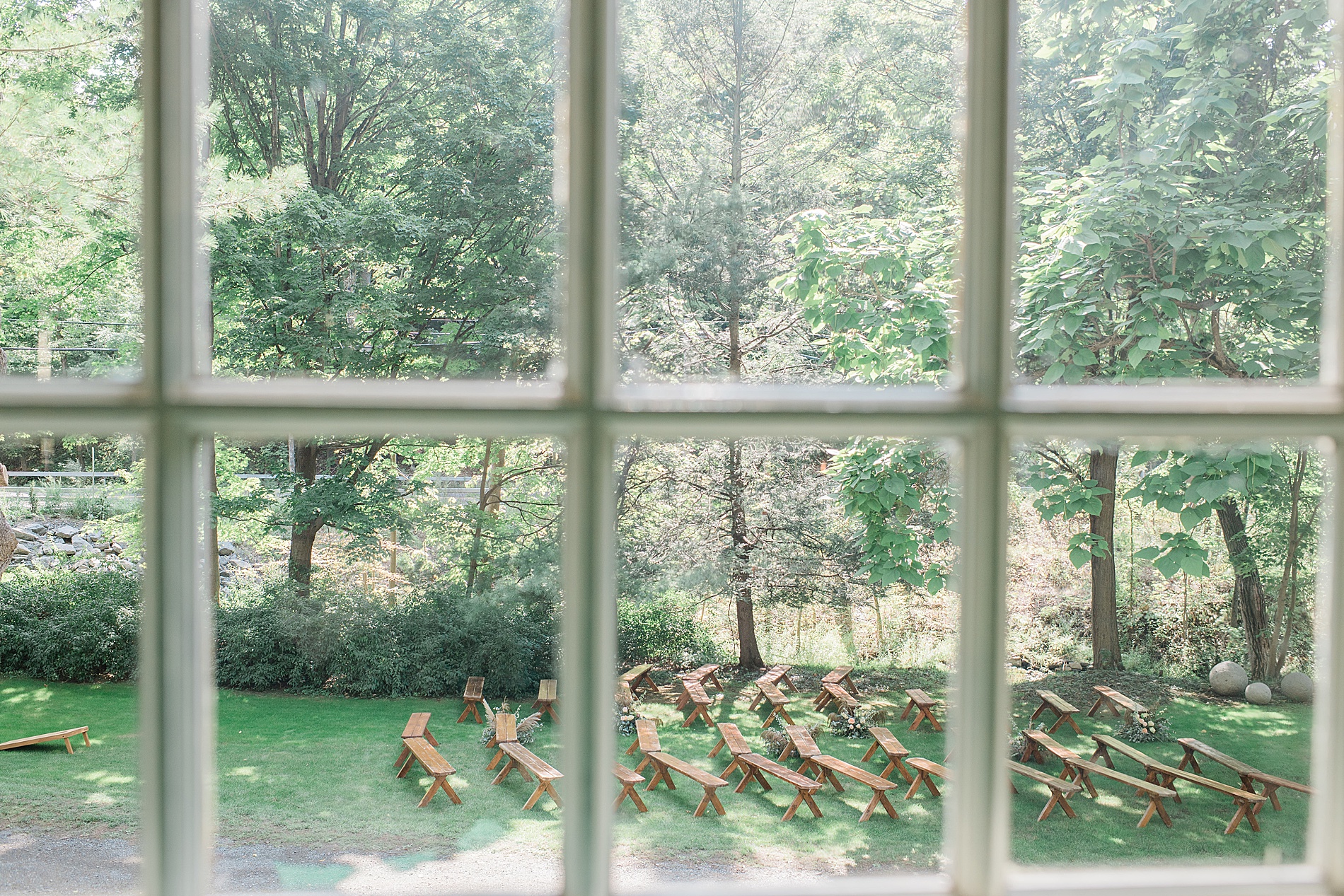 camera looking at ceremony set up through window