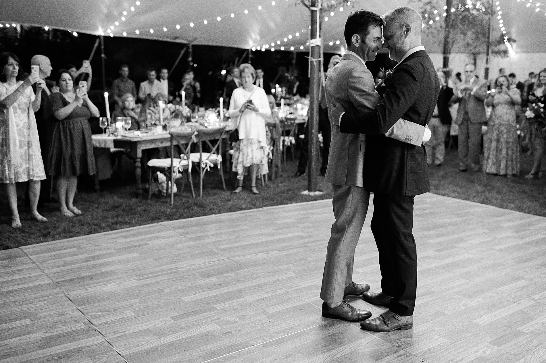 grooms share dance together at reception