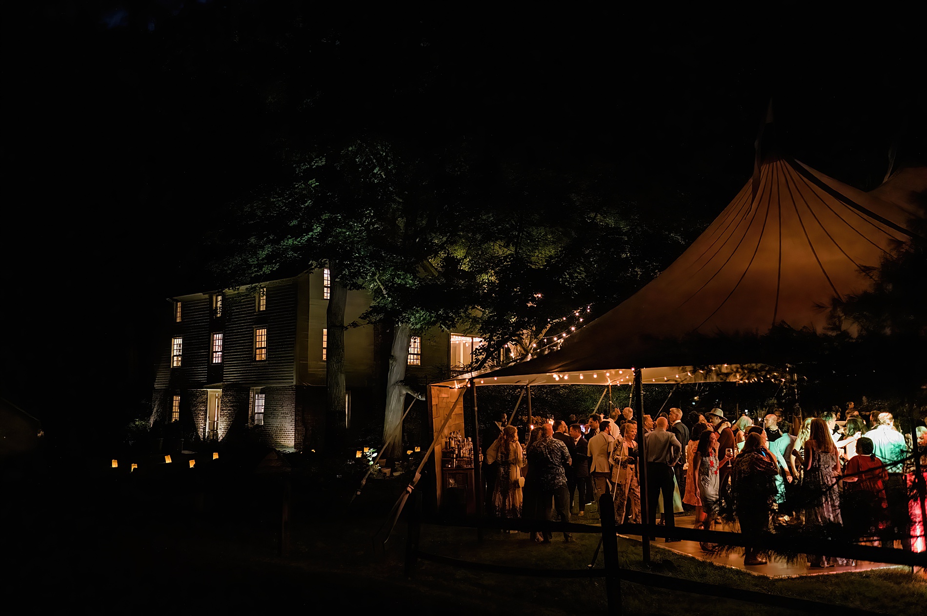tented wedding reception lit up at night from Hudson Valley Wedding at Private Estate