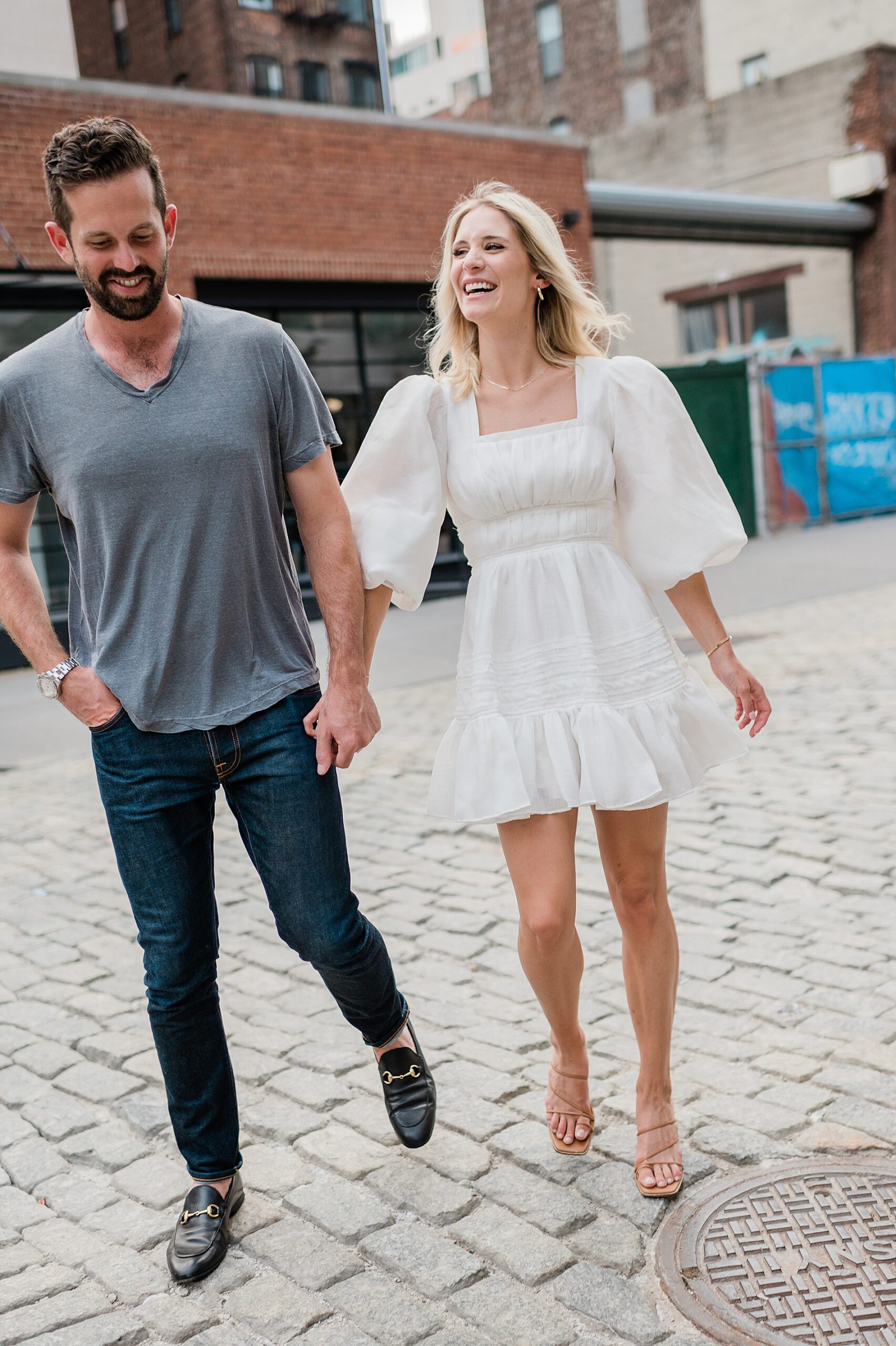 candid engagement photos of couple walking together