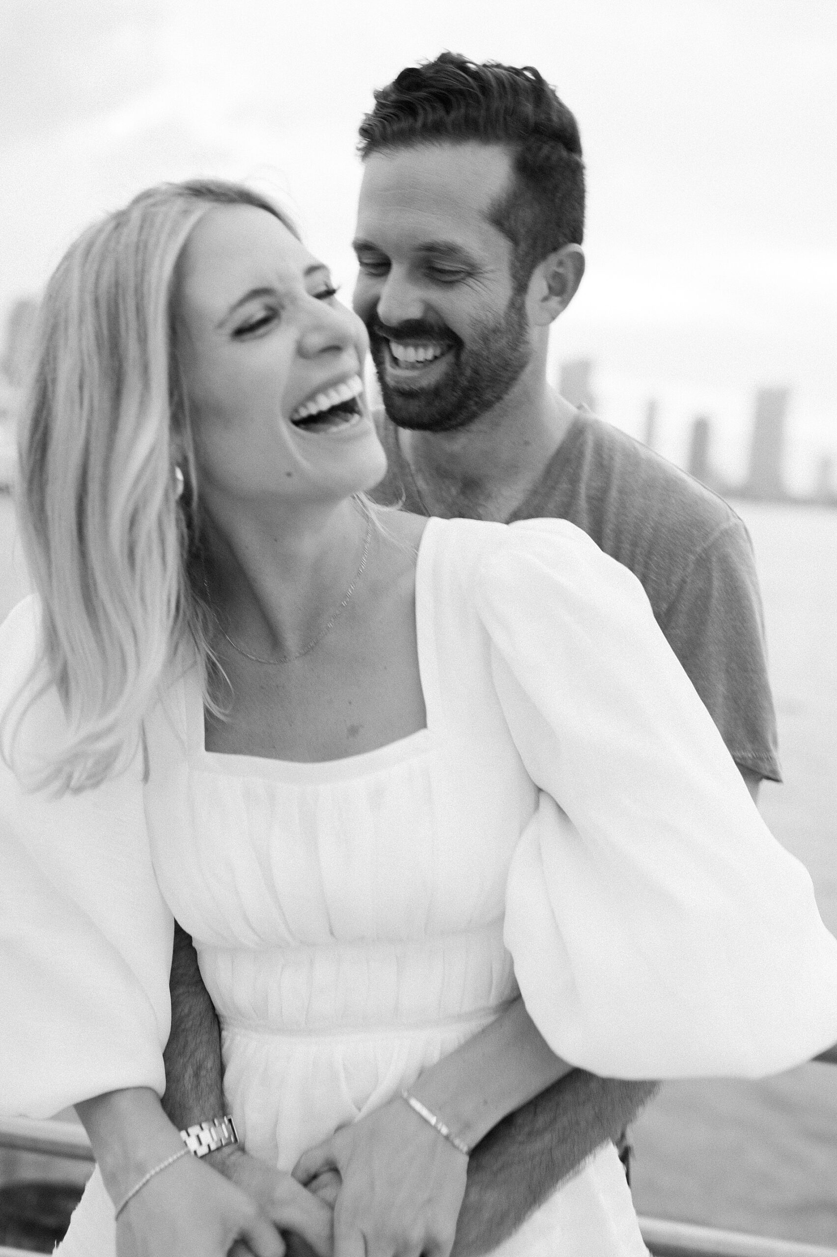 couple laughing together during engagement photos