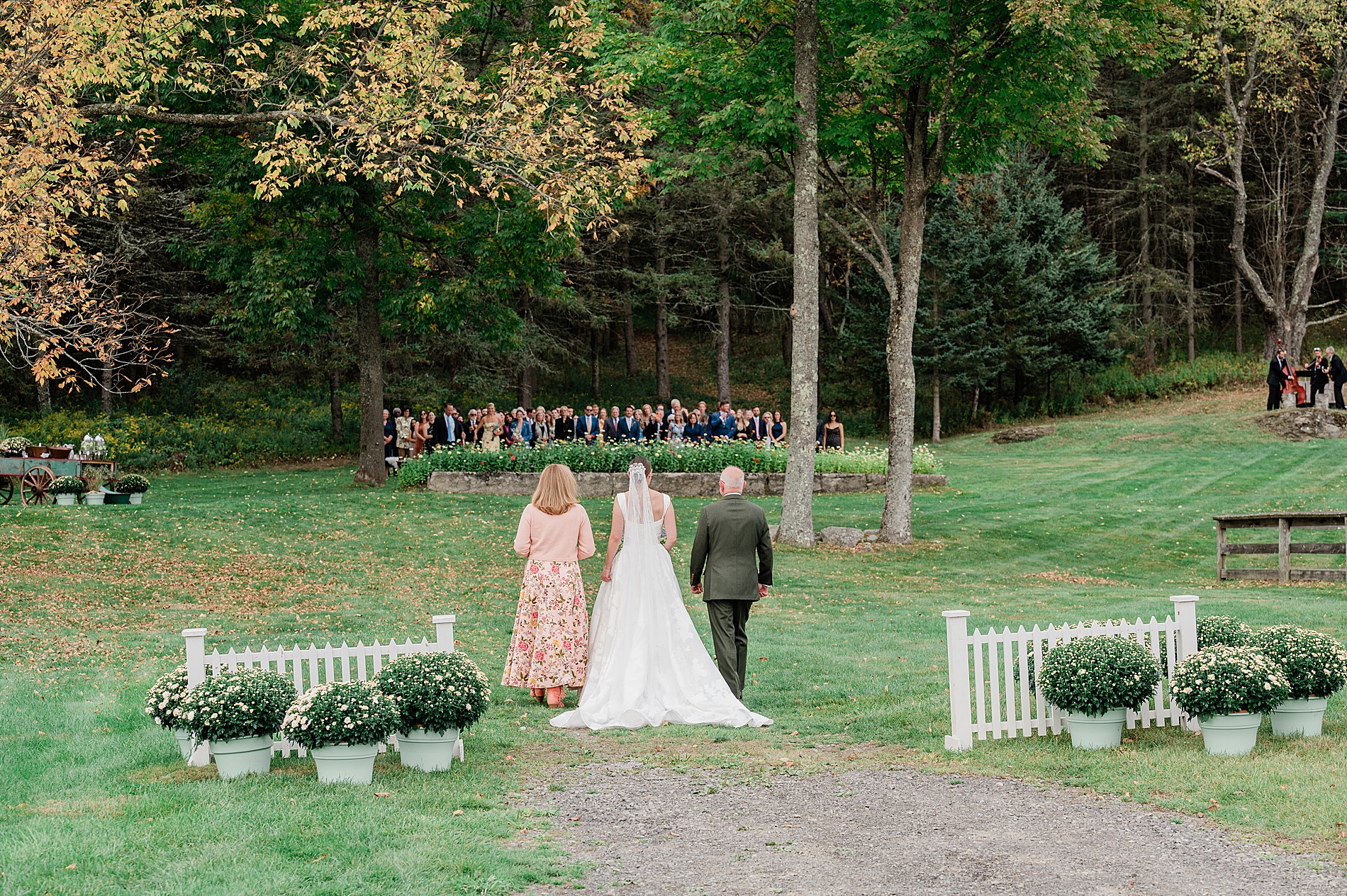 bride with parents walking her down the aisle