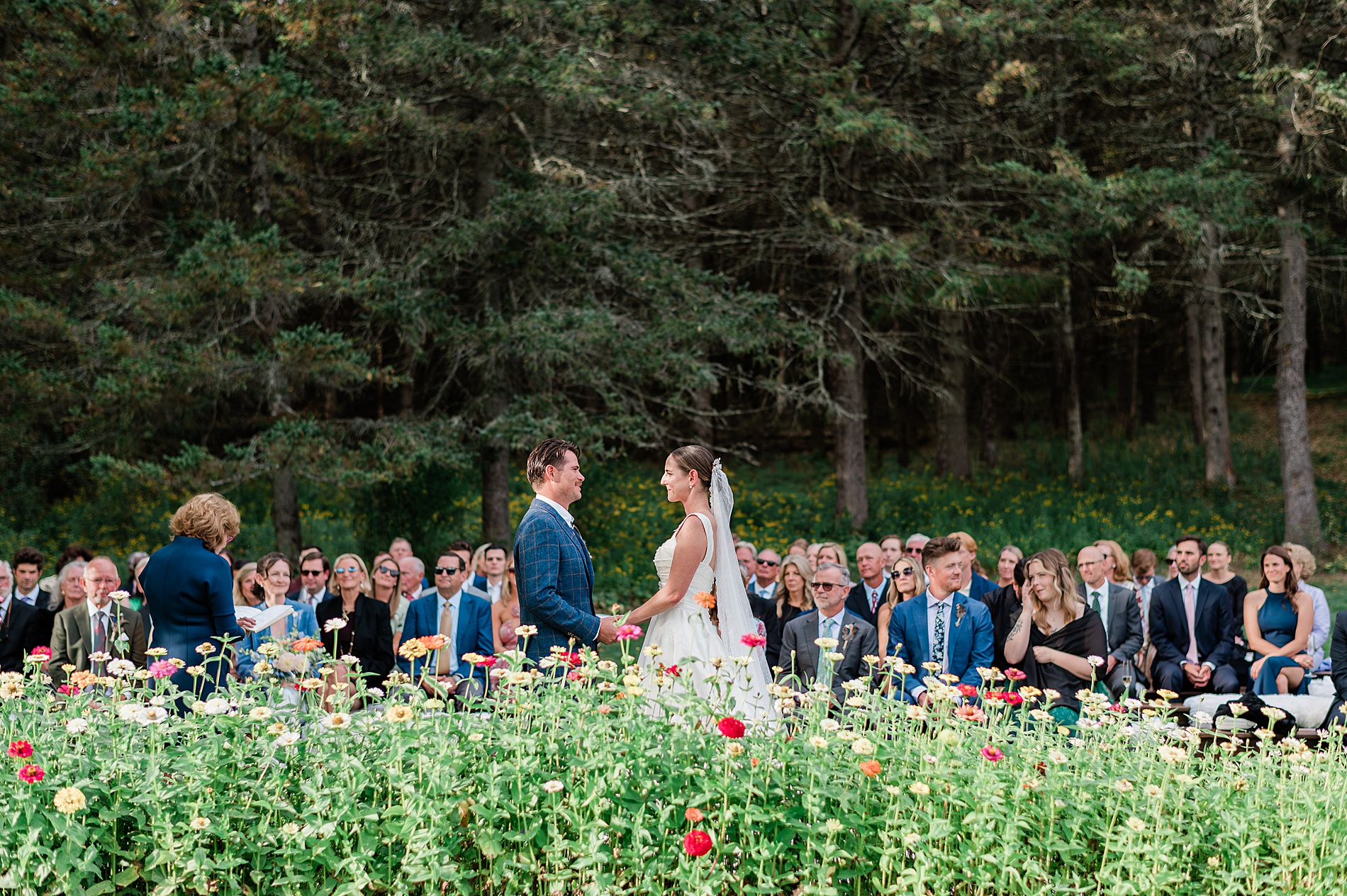 Zinnias decorate wedding ceremony space at Private Estate Wedding in New York