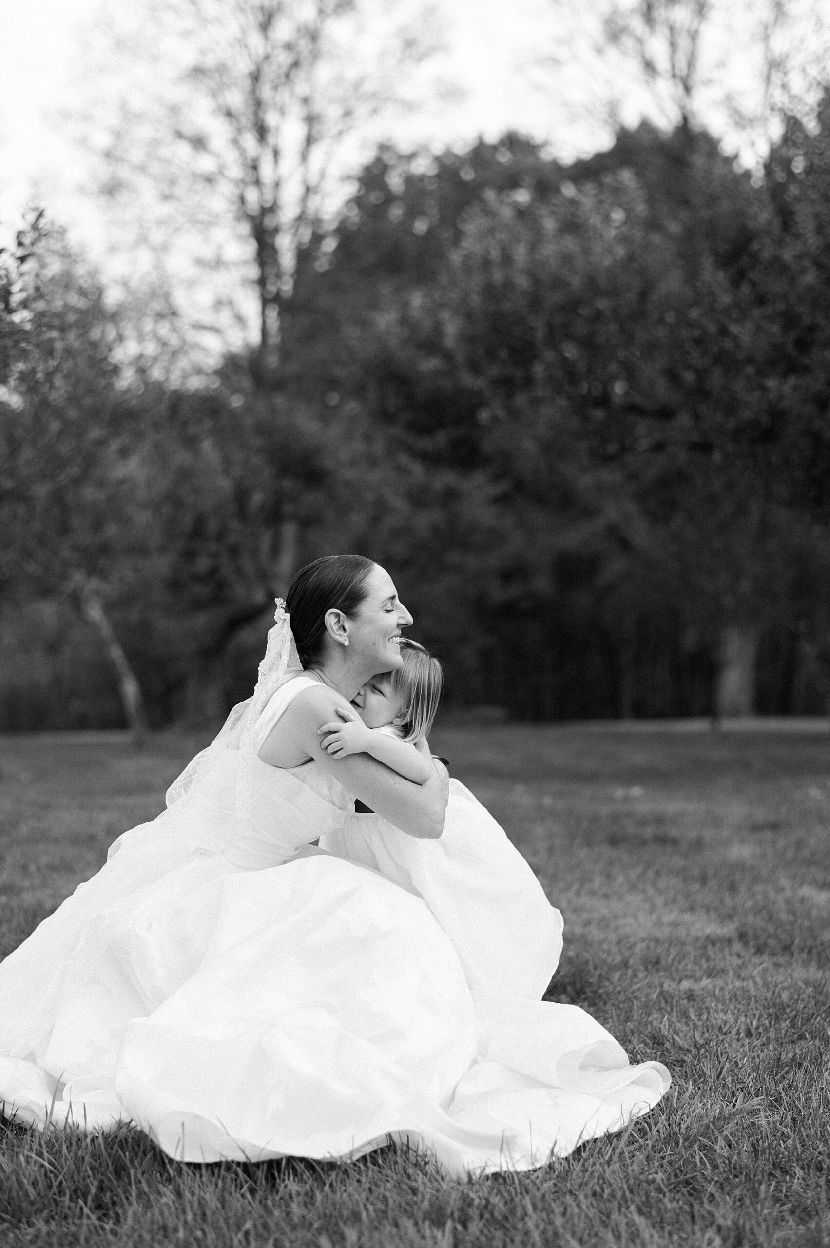 bride hugs flower girl