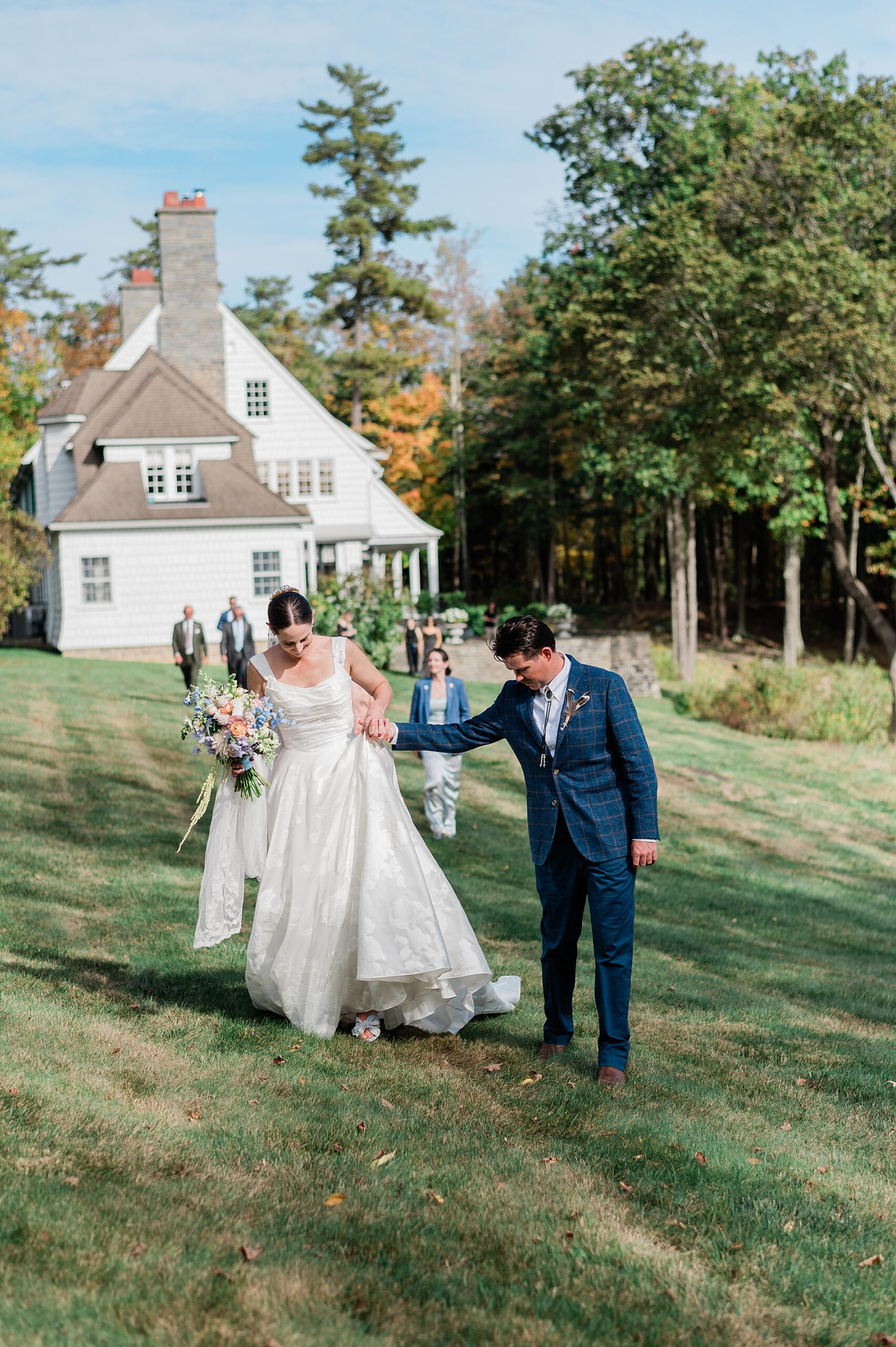 newlyweds and wedding party leaving ceremony space