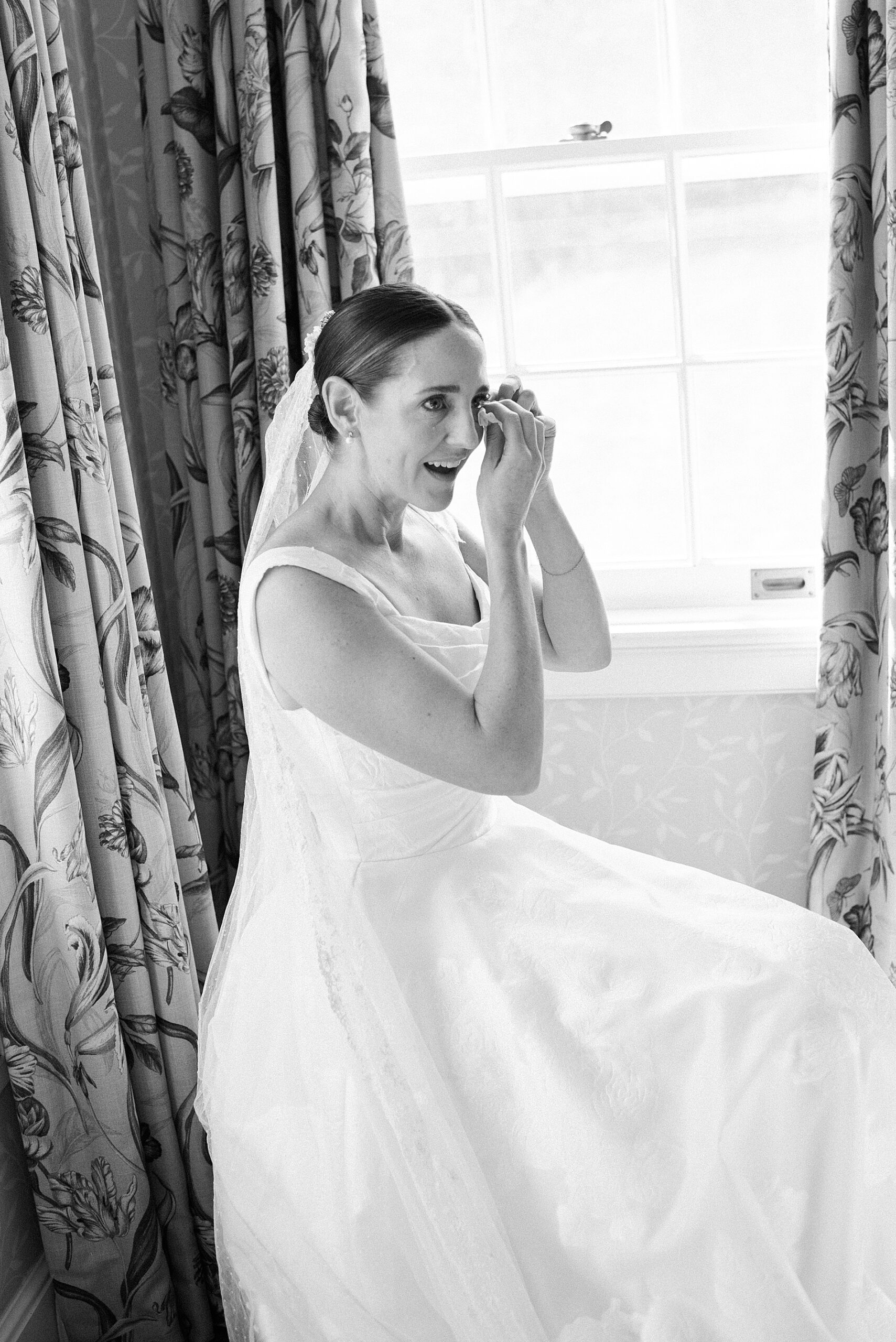 bride wipes away tears
