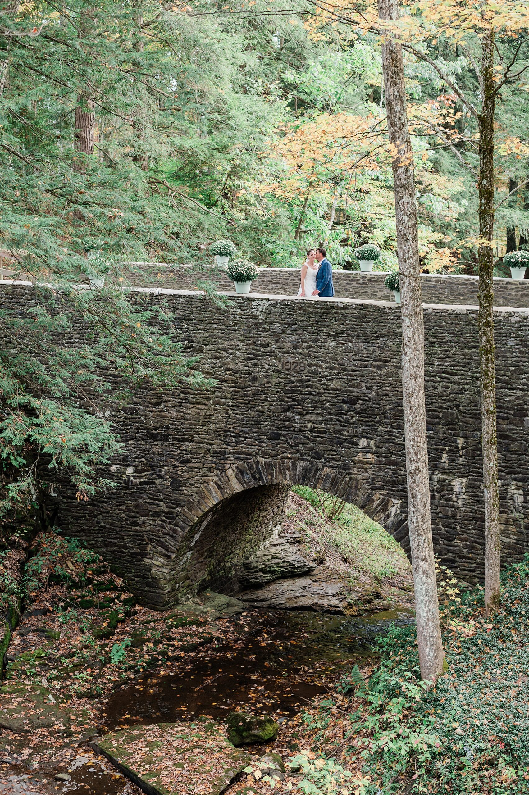 wedding photos on stone bridge