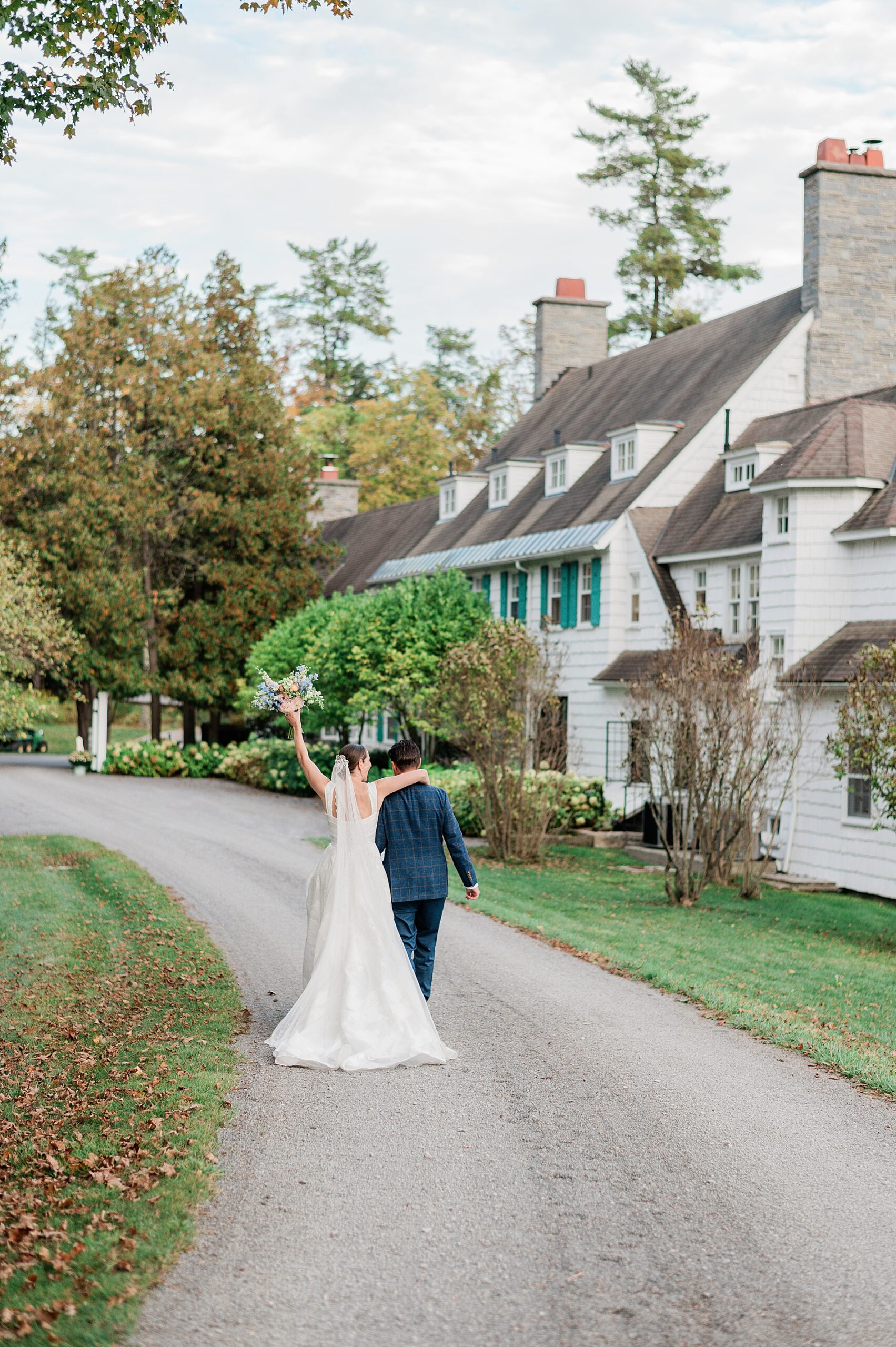 bride and groom walk along private estate before wedding ceremony