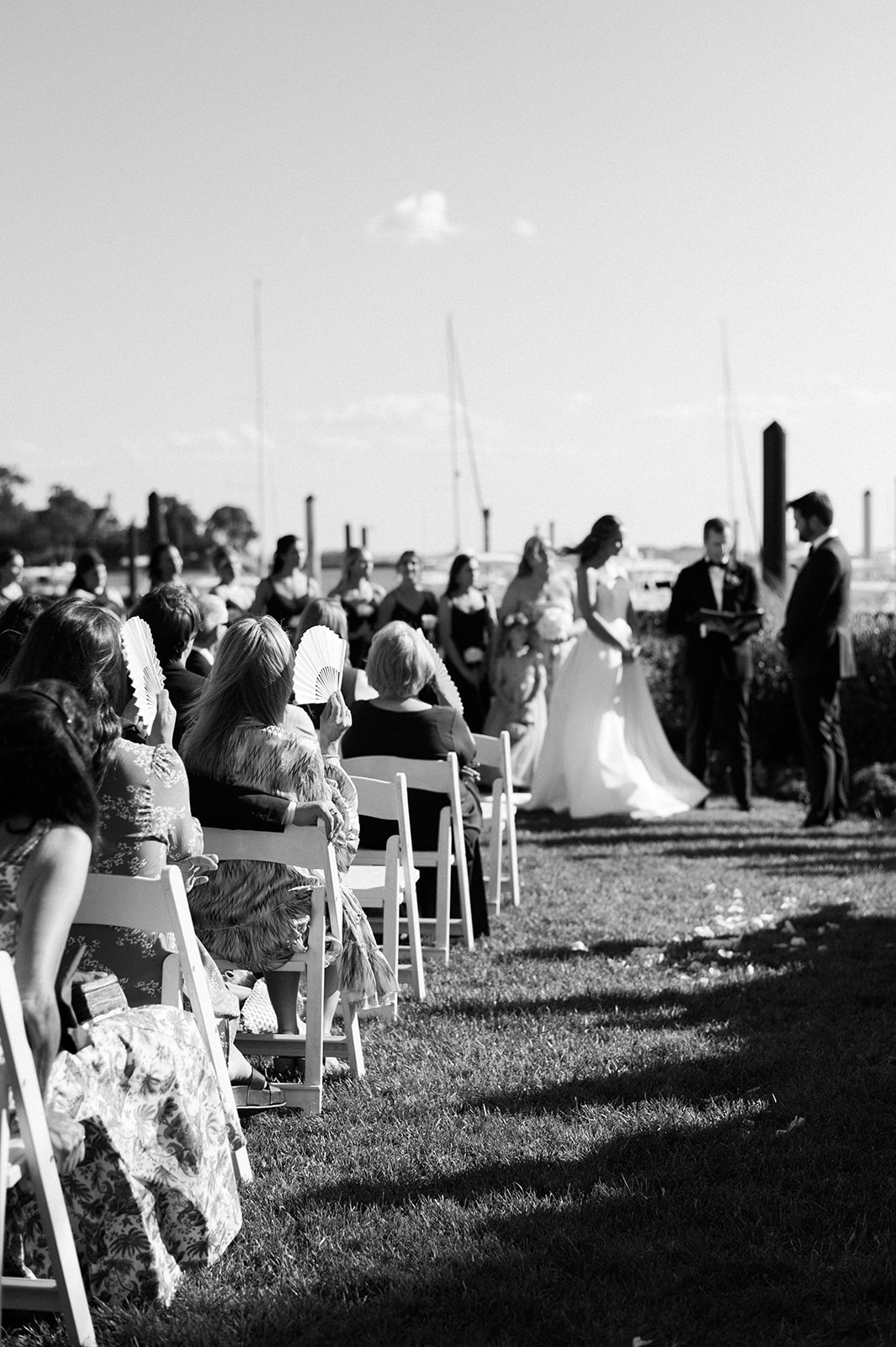 summer wedding ceremony by the water at Riverside Yacht Club  
