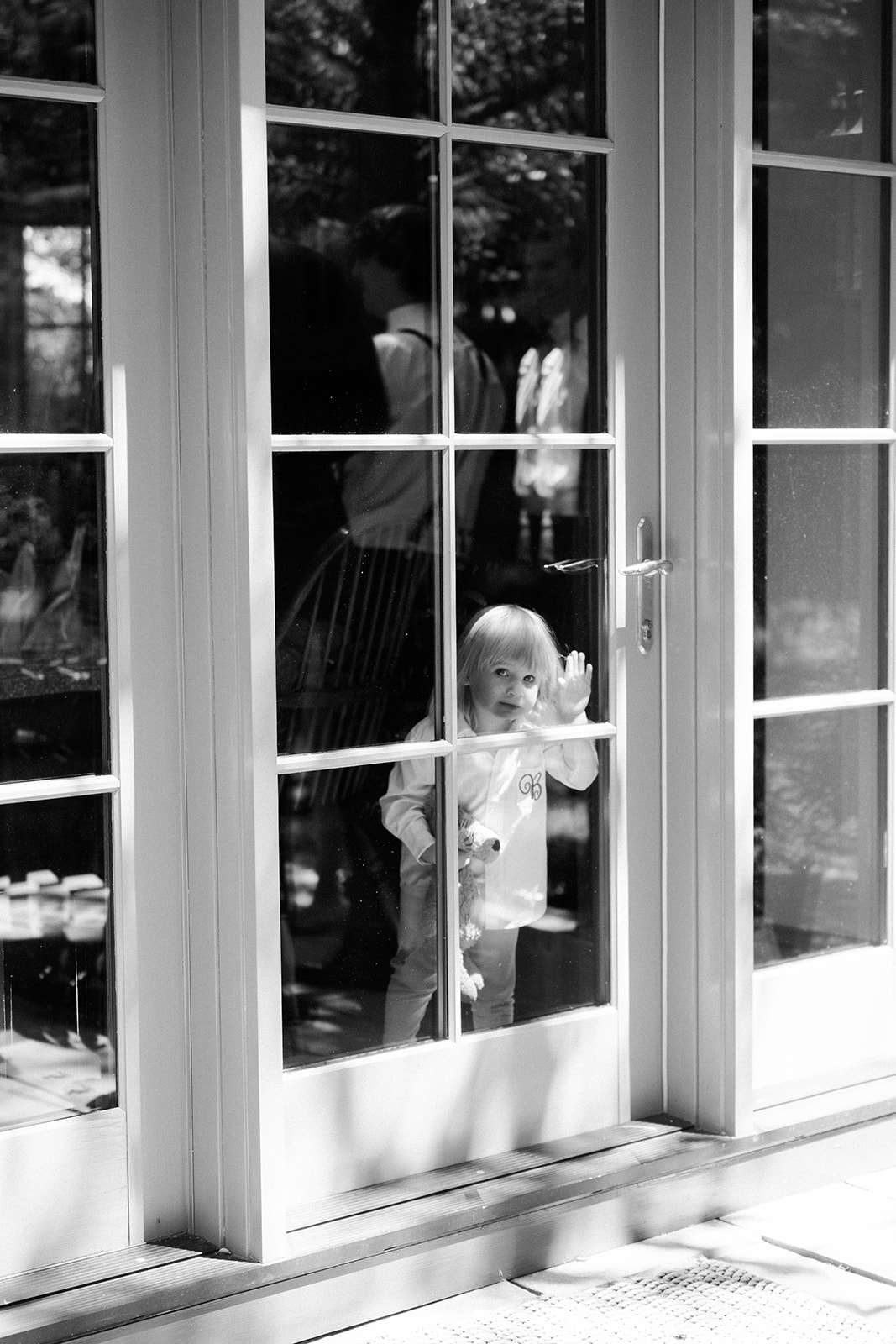flower girl looking out window