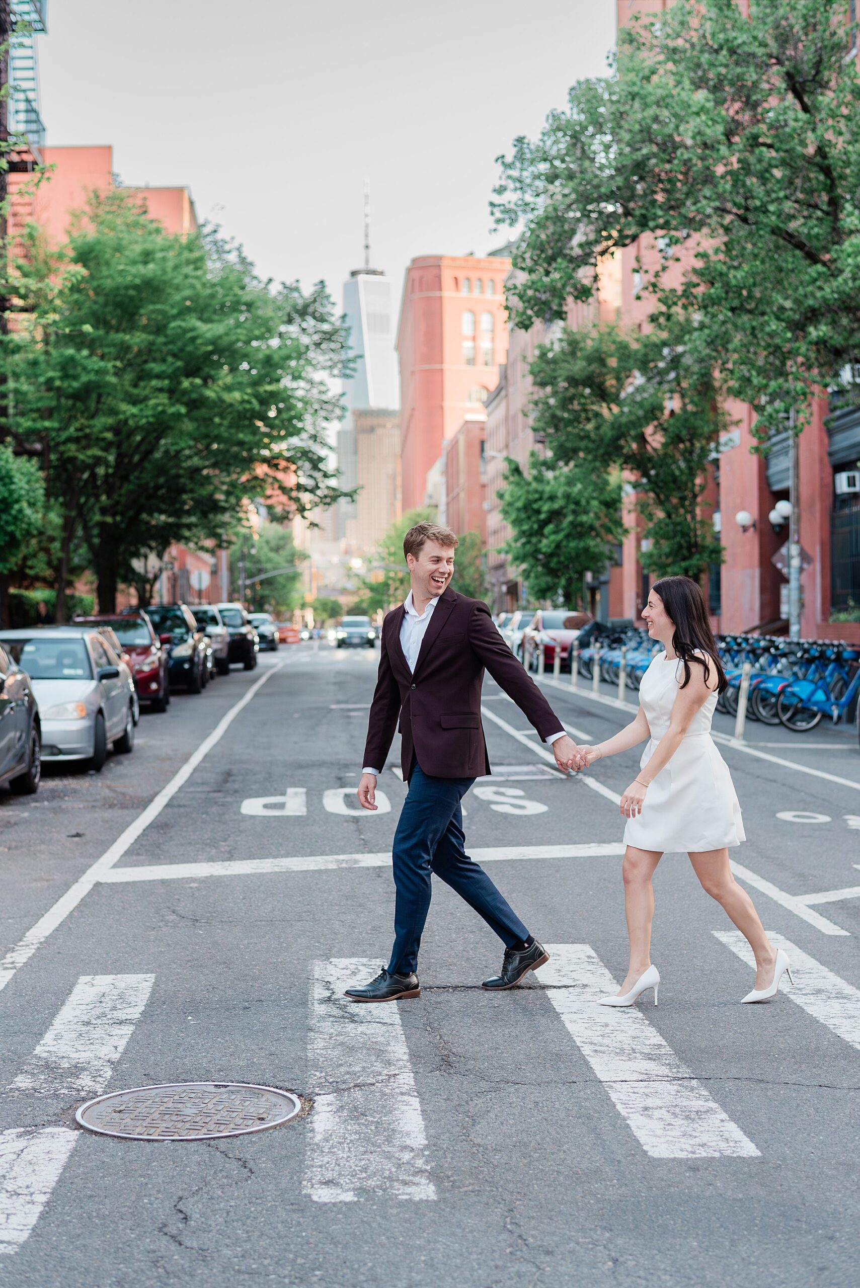 couple cross the street holding hands