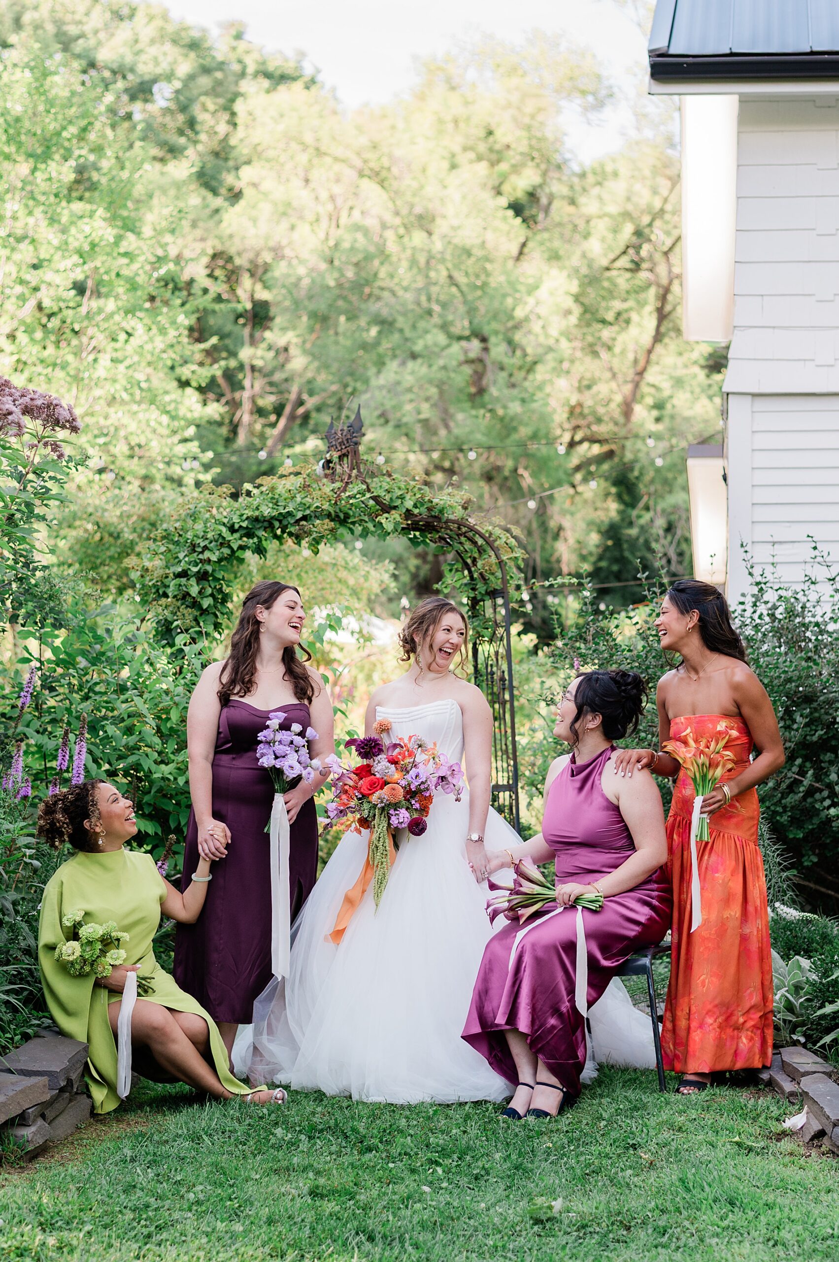 bridesmaids sit around bride