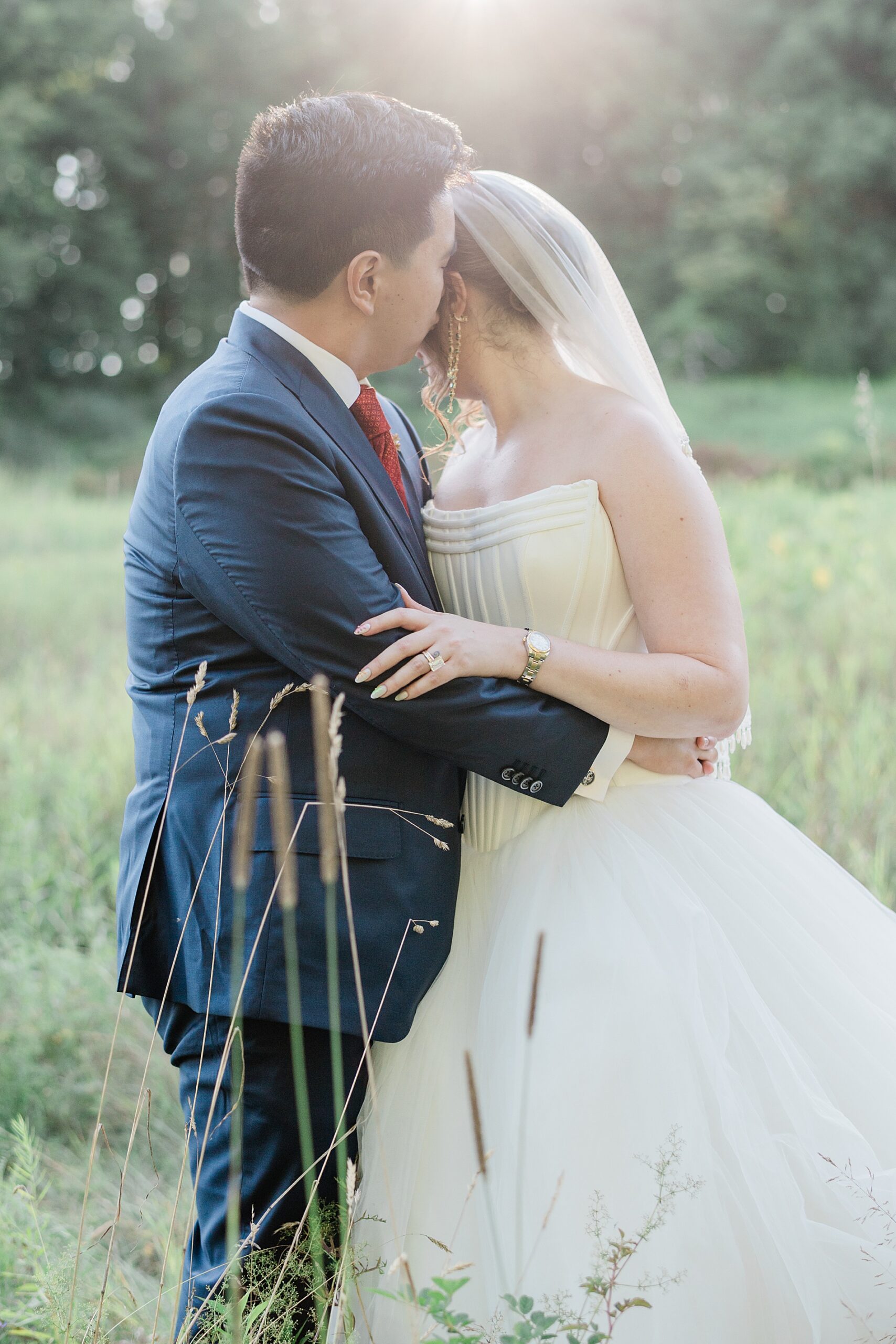 romantic wedding portraits in field of tall grass