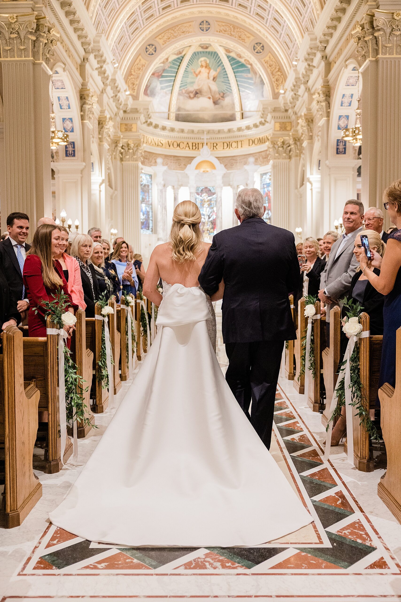 bride walking down the aisle with father