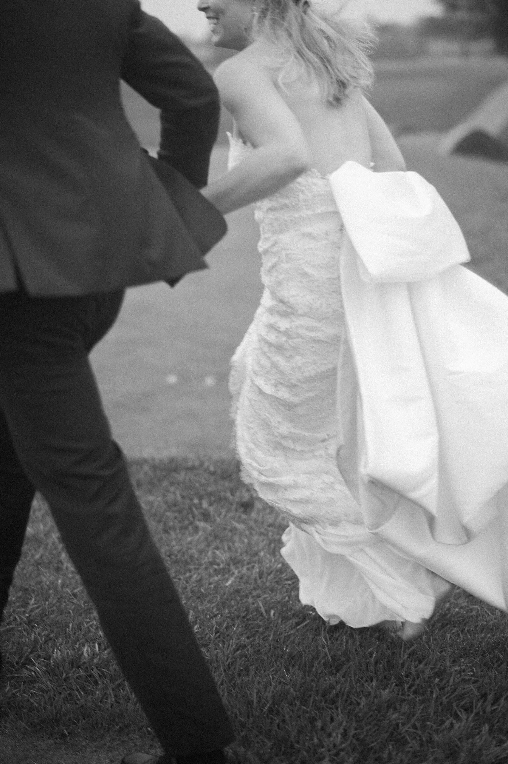 newlyweds holding hands as they walk together 