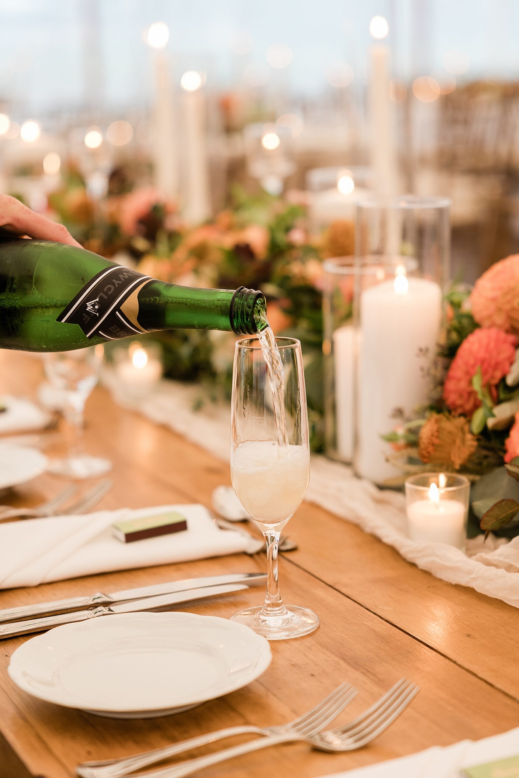 champagne being poured for wedding guests 
