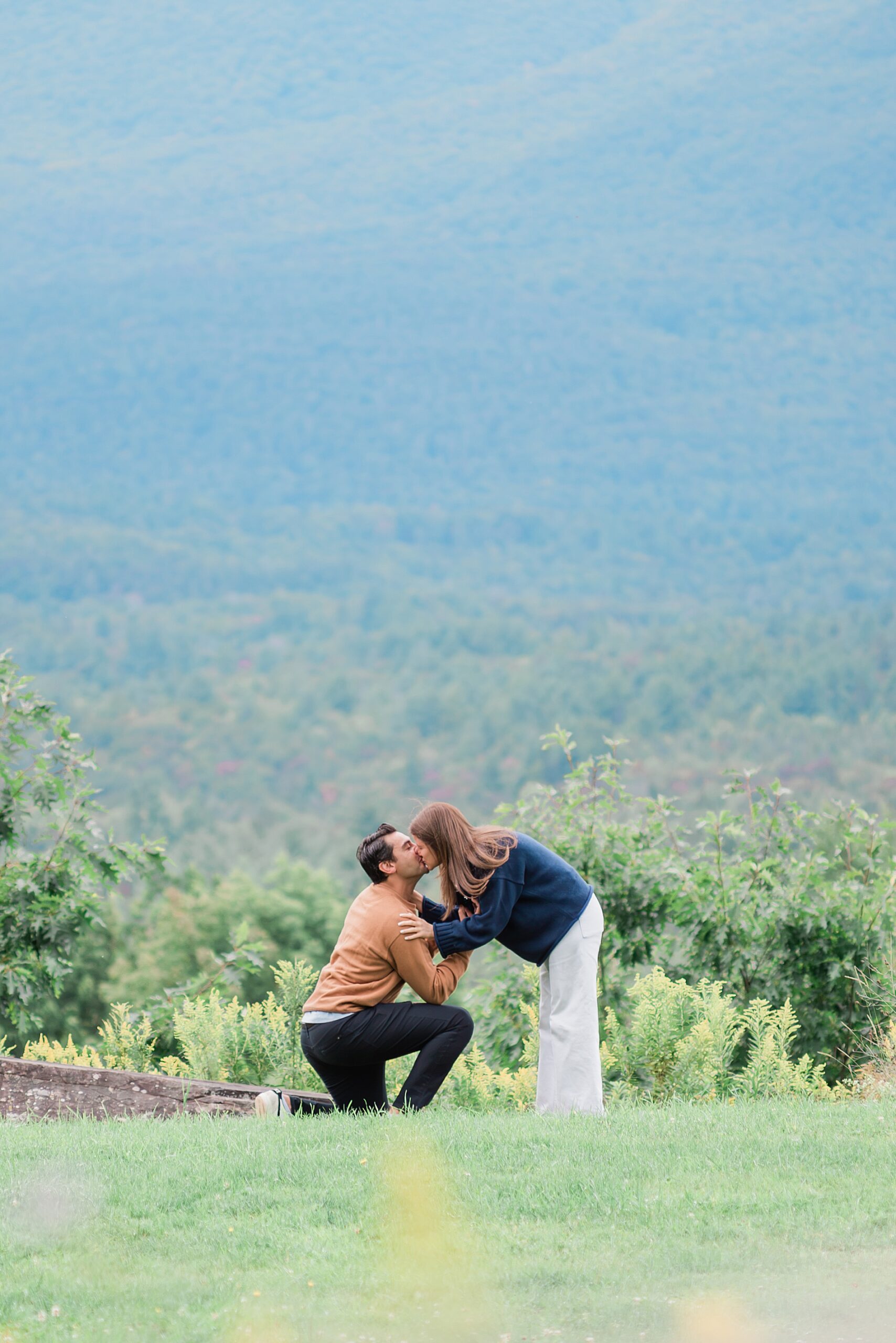 couple kiss after surprise proposal 