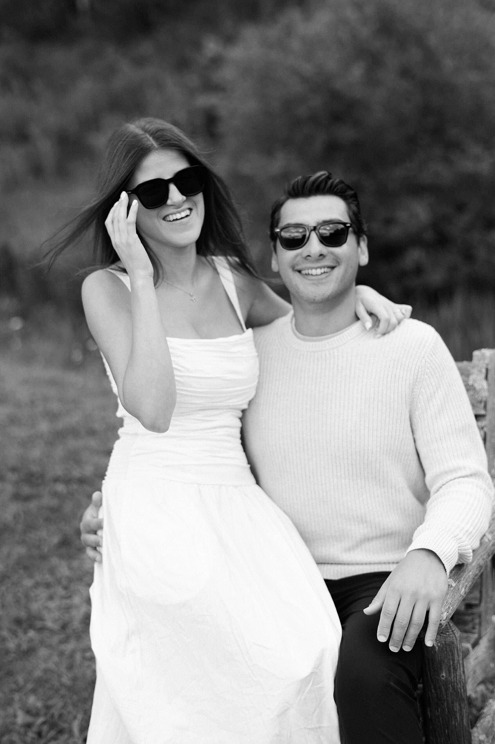 couple wears sunglasses during engagement portraits after surprise proposal 