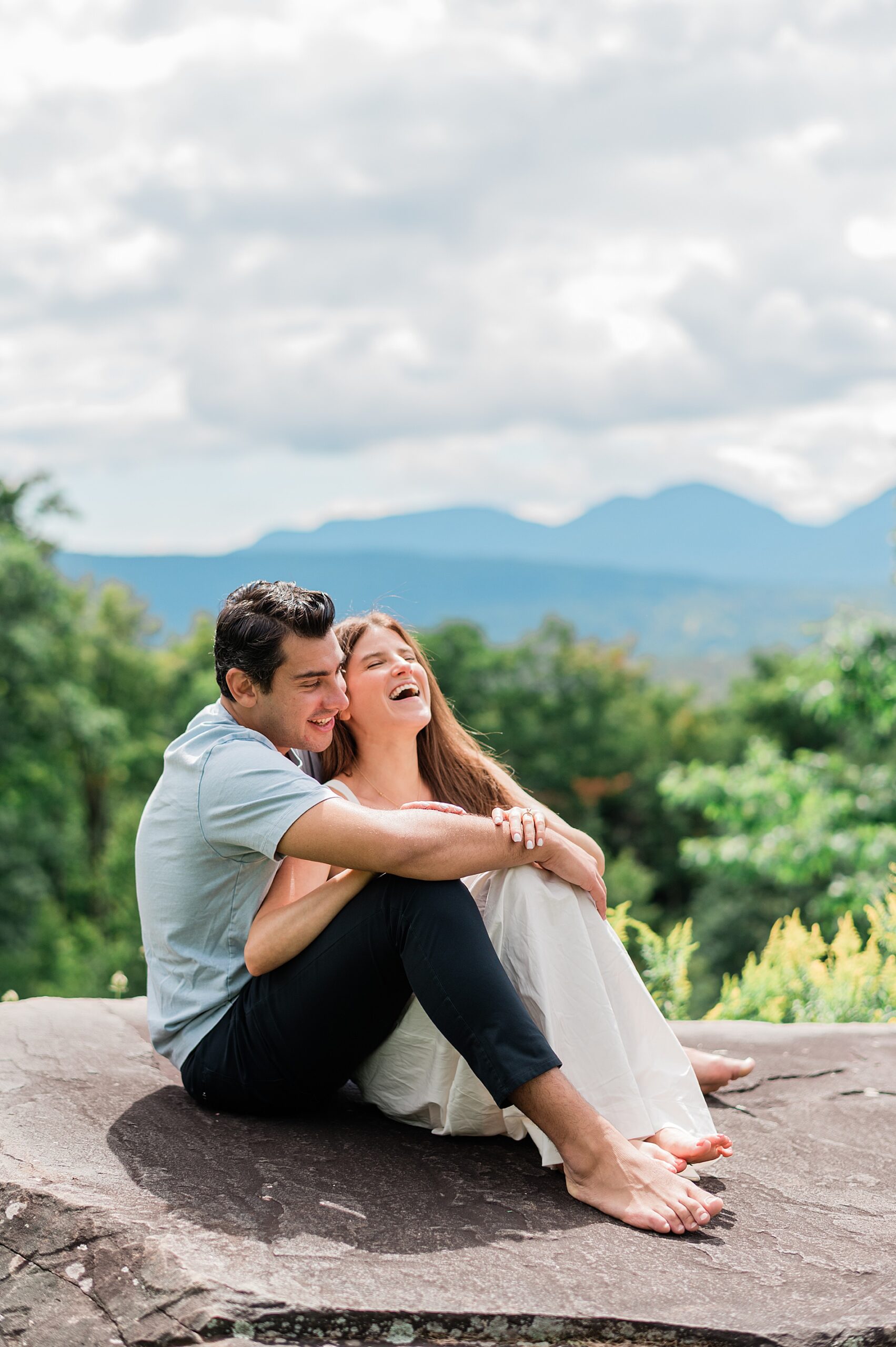 candid photos of newly engaged couple at Deer Mountain Inn